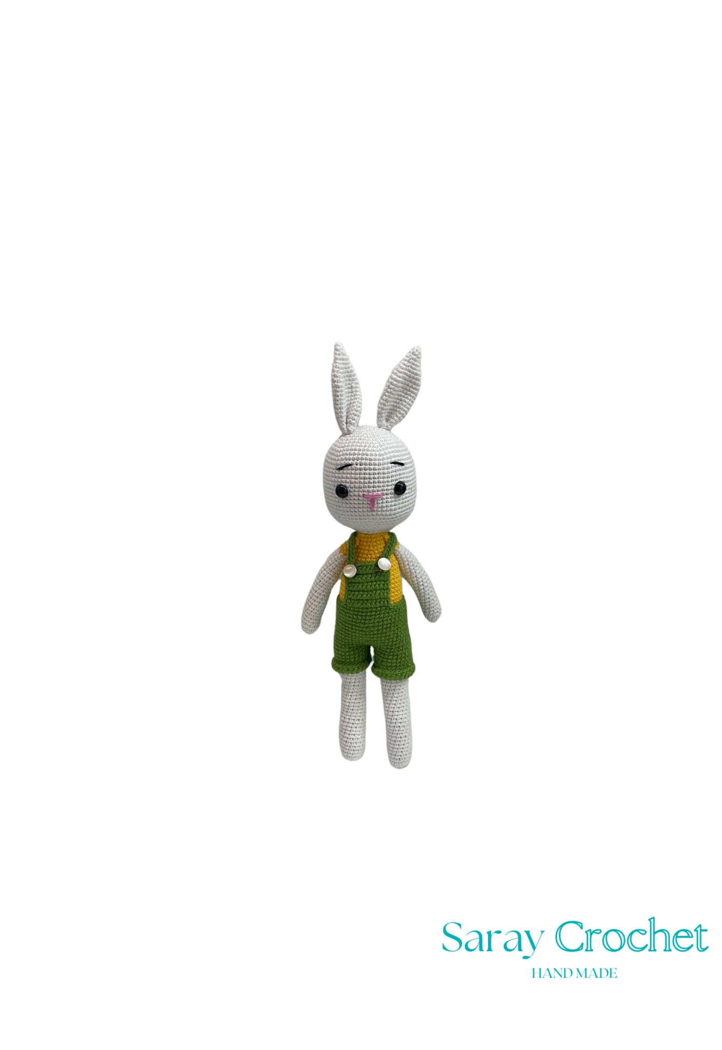 A crochet doll resembling a rabbit with a gray body, green overalls, and a expressionless face.