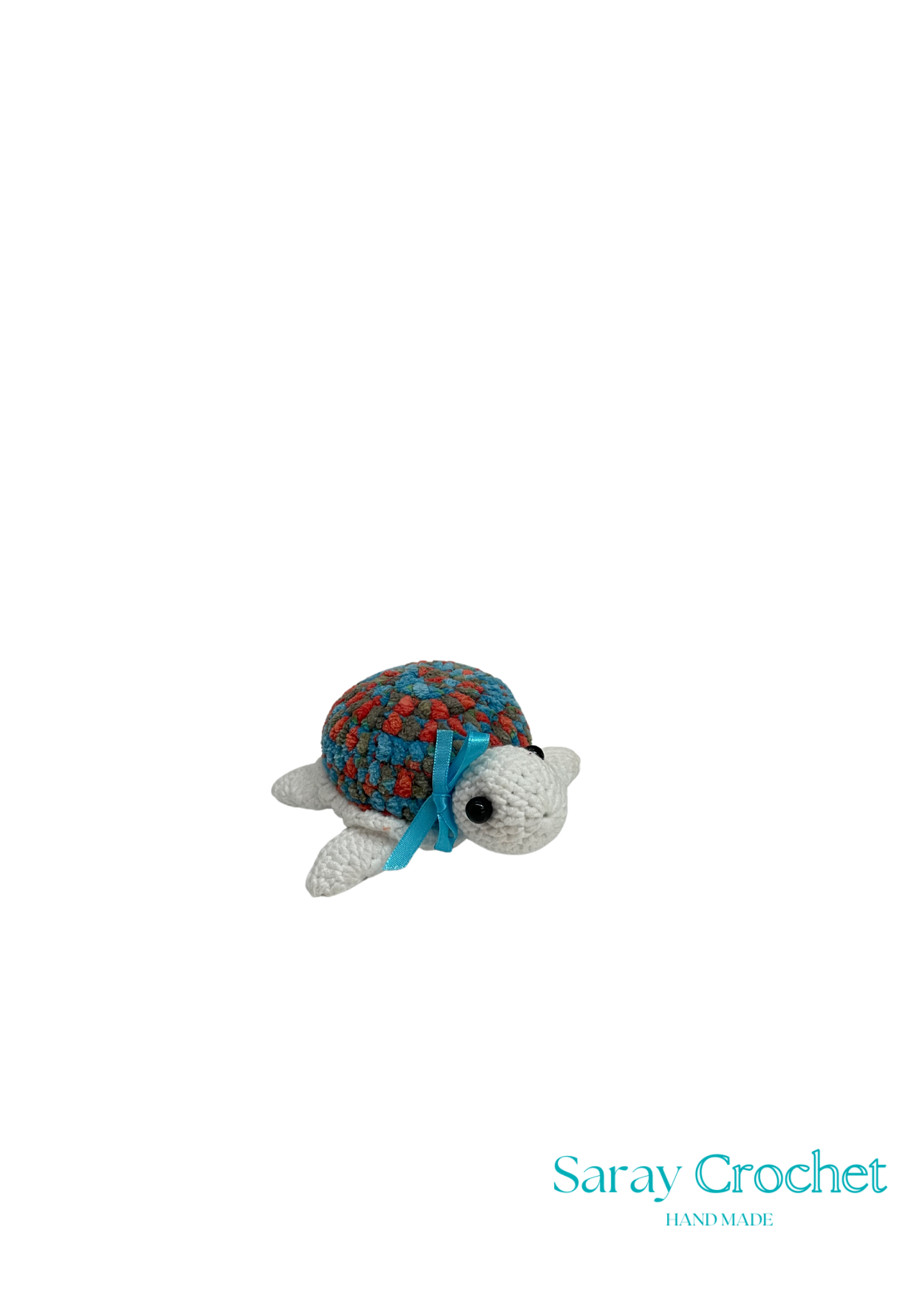 Stuffed turtle toy with a multicolored shell and solid blue body, with the brand name 'Saray Crochet' visible.
