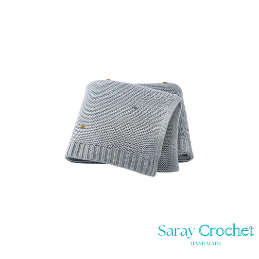 Folded gray knitted blanket with 'Saray Crochet' branding on a white background