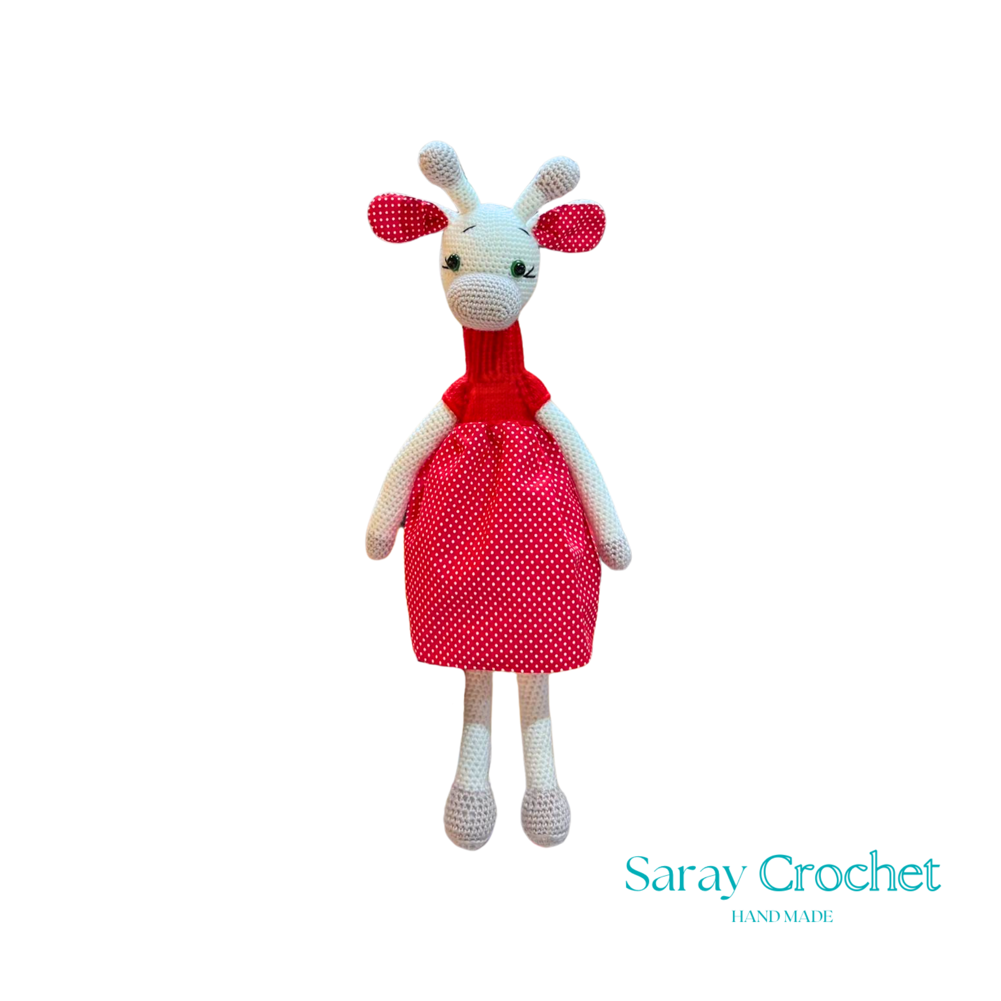 Handmade plush giraffe toy with a red dress and white body, standing upright.