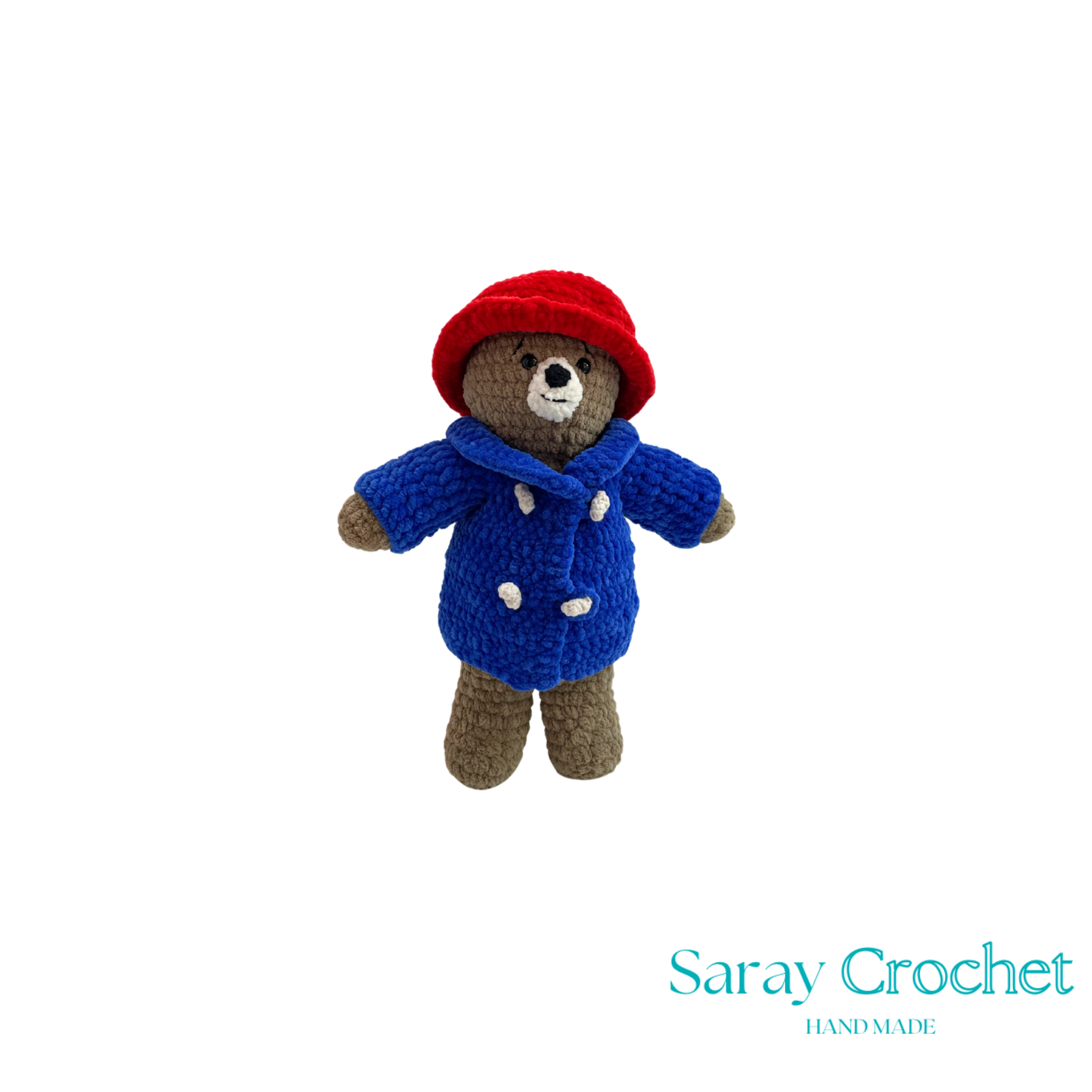 Crocheted bear toy wearing a red hat and blue coat on a white background with 'Saray Crochet' branding.