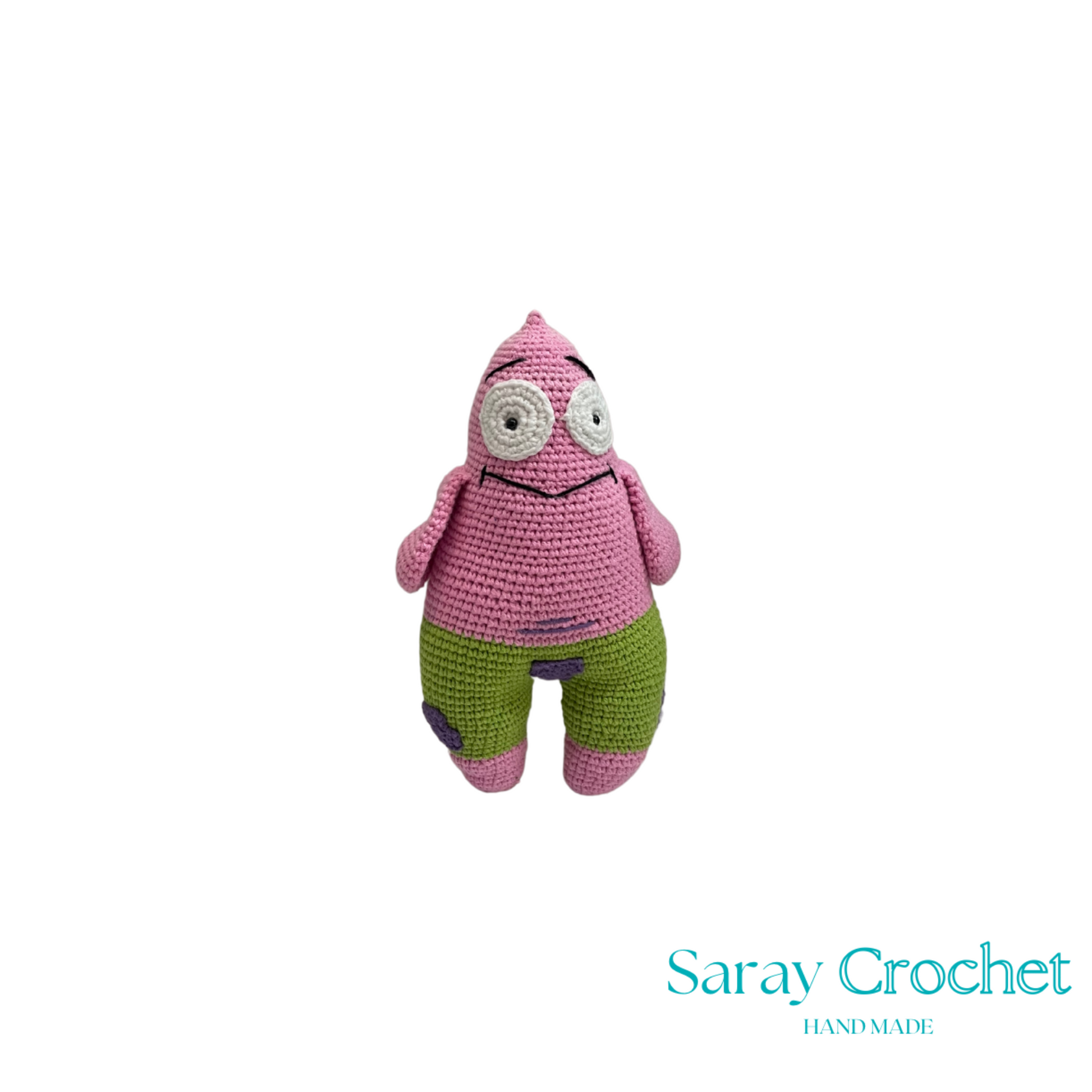 Crocheted pink and green creature toy with 'Saray Crochet' branding on a white background