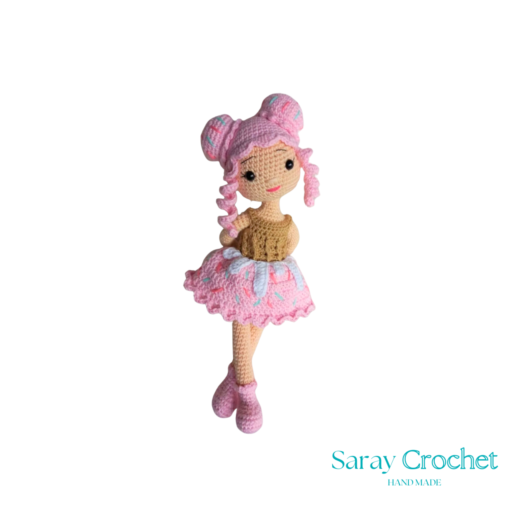 Handmade doll with a cupcake design, featuring a pink dress and matching hat.